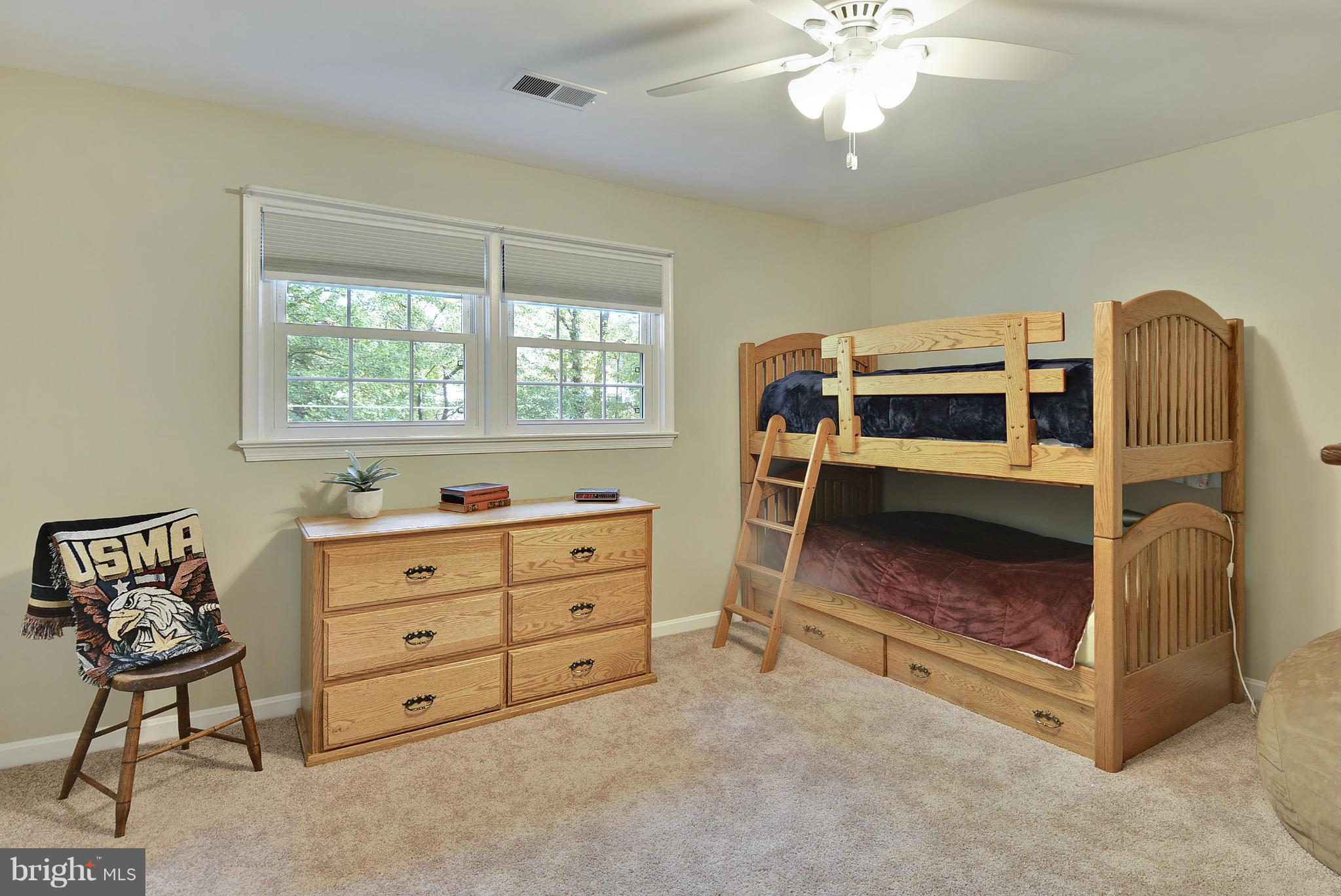 6731 Houndmaster Road Springfield, VA 22152 - Photo 17 of 30 a bed room with a bed and a window