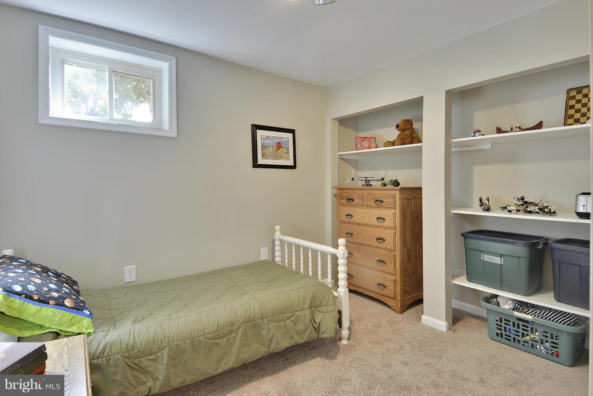 6731 Houndmaster Road Springfield, VA 22152 - Photo 19 of 30 a bedroom with a bed and furniture