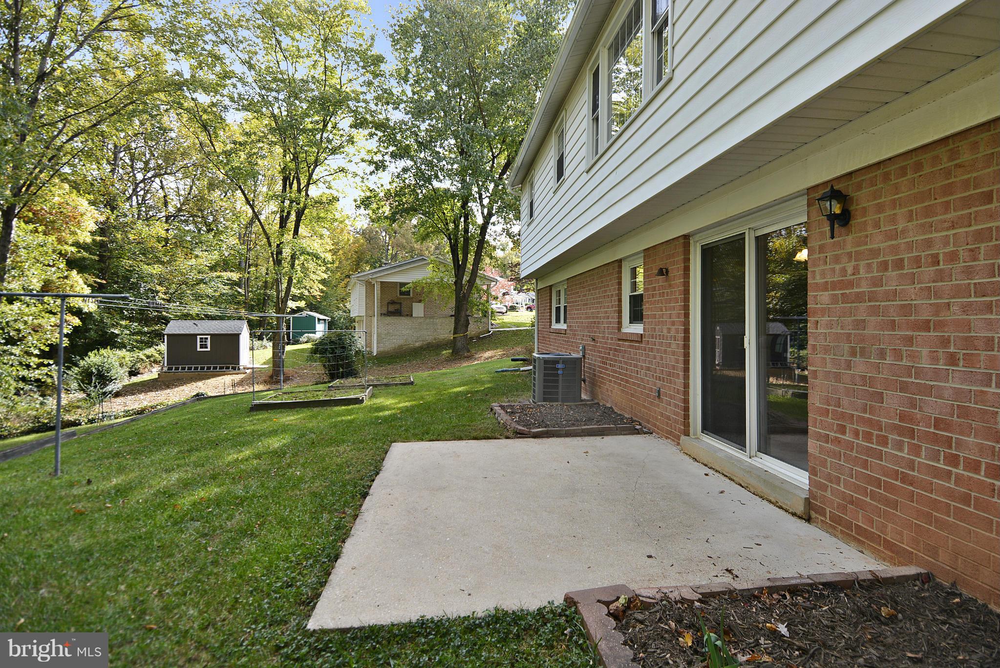 6731 Houndmaster Road Springfield, VA 22152 - Photo 21 of 30 front view of a house with a yard