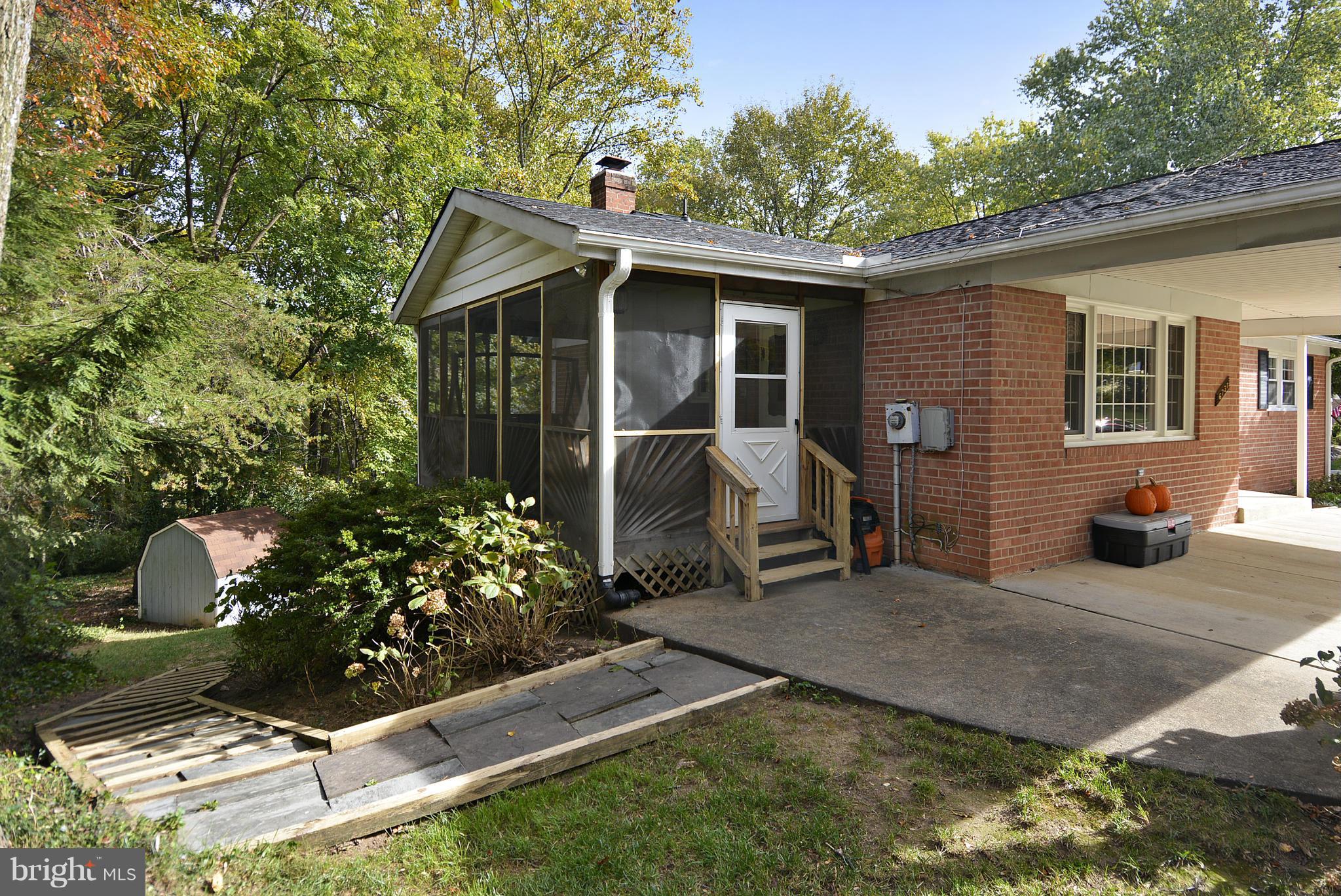 6731 Houndmaster Road Springfield, VA 22152 - Photo 22 of 30 a front view of a house with garden