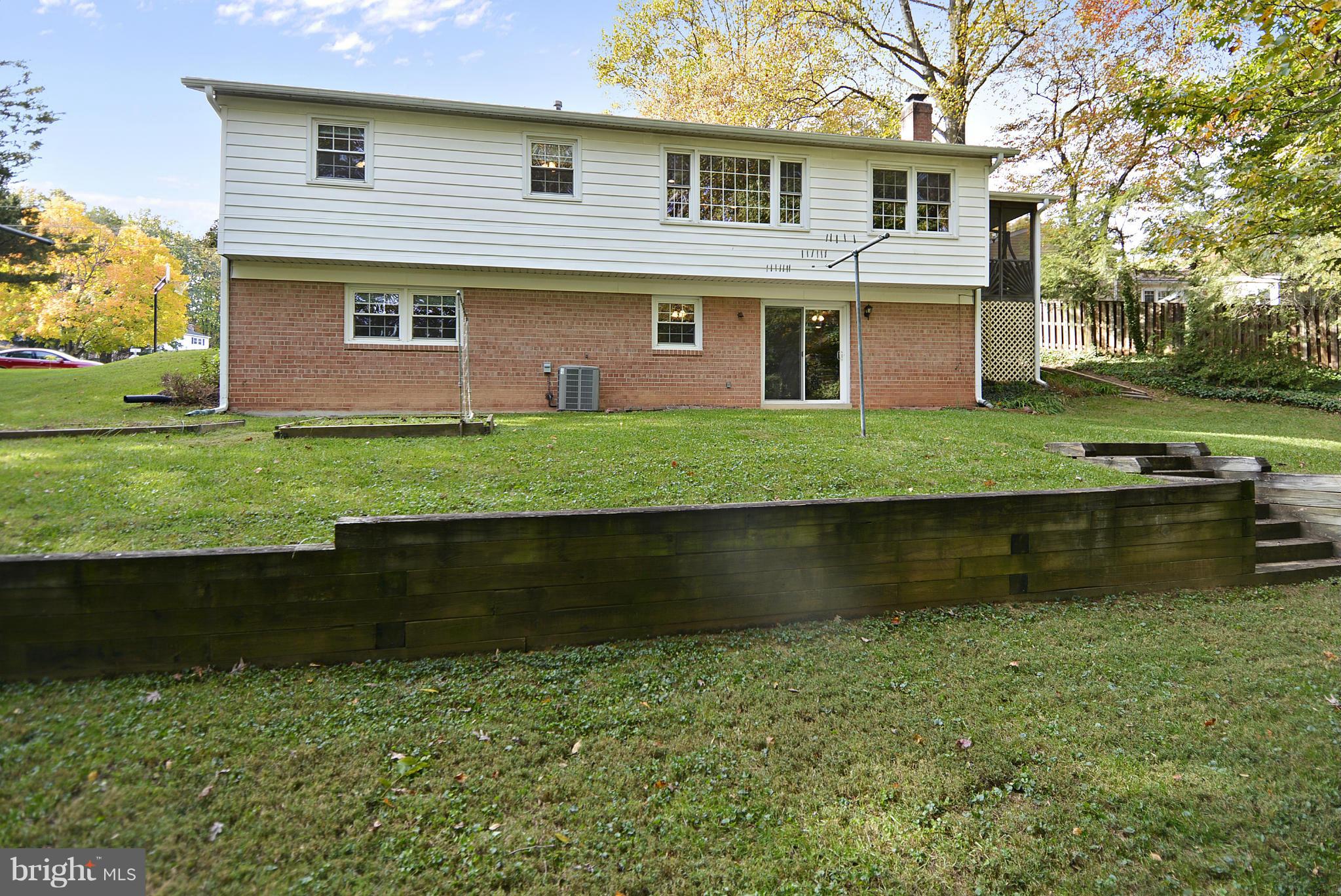 6731 Houndmaster Road Springfield, VA 22152 - Photo 24 of 30 a front view of a house with a yard