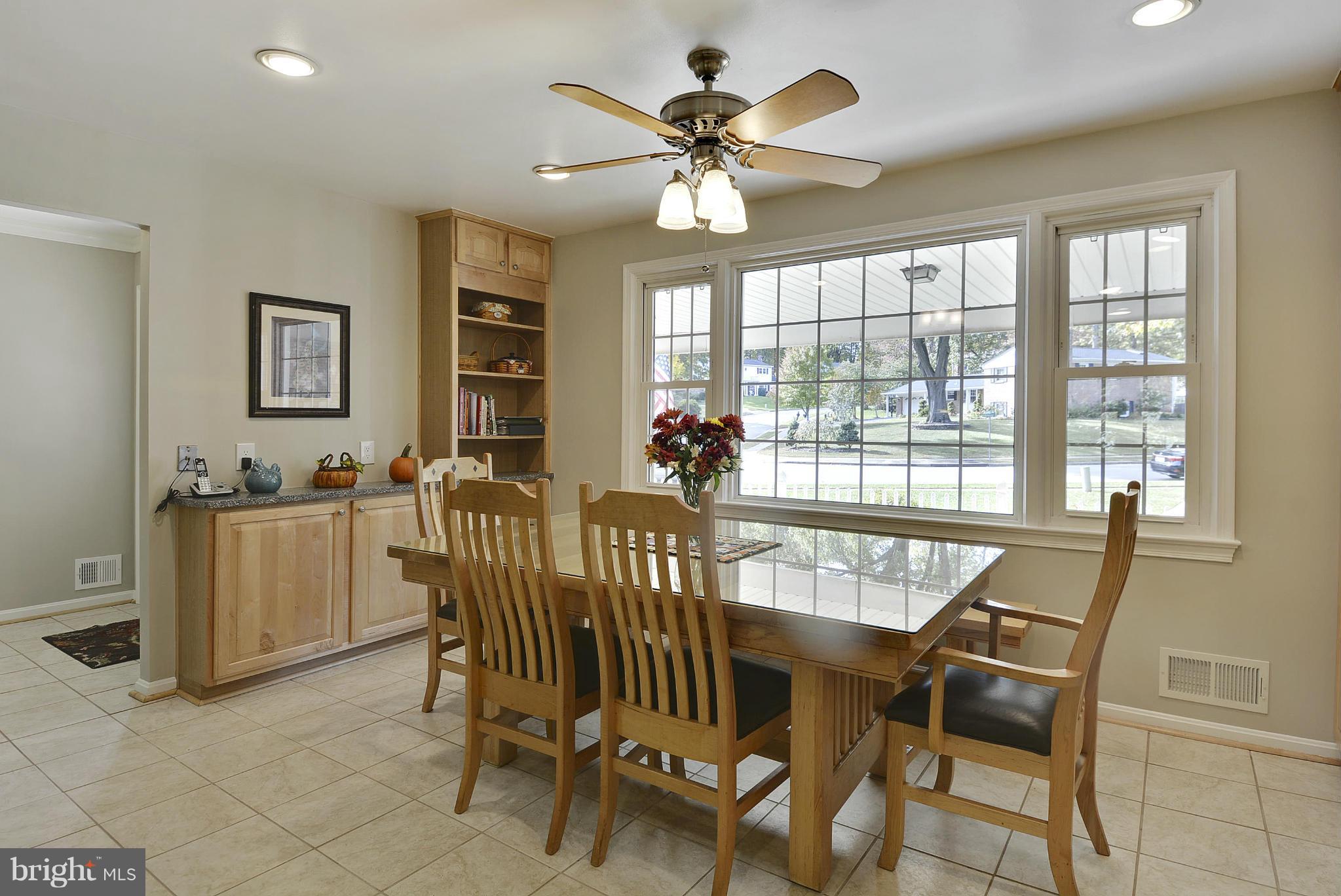 6731 Houndmaster Road Springfield, VA 22152 - Photo 6 of 30 a view of a dining room with furniture window and outside view