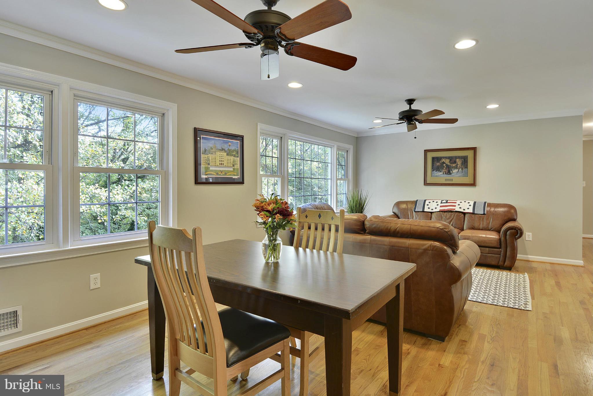 6731 Houndmaster Road Springfield, VA 22152 - Photo 8 of 30 a view of a dining room with furniture window and wooden floor
