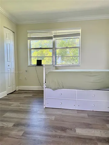 a view of a livingroom with an empty space and window