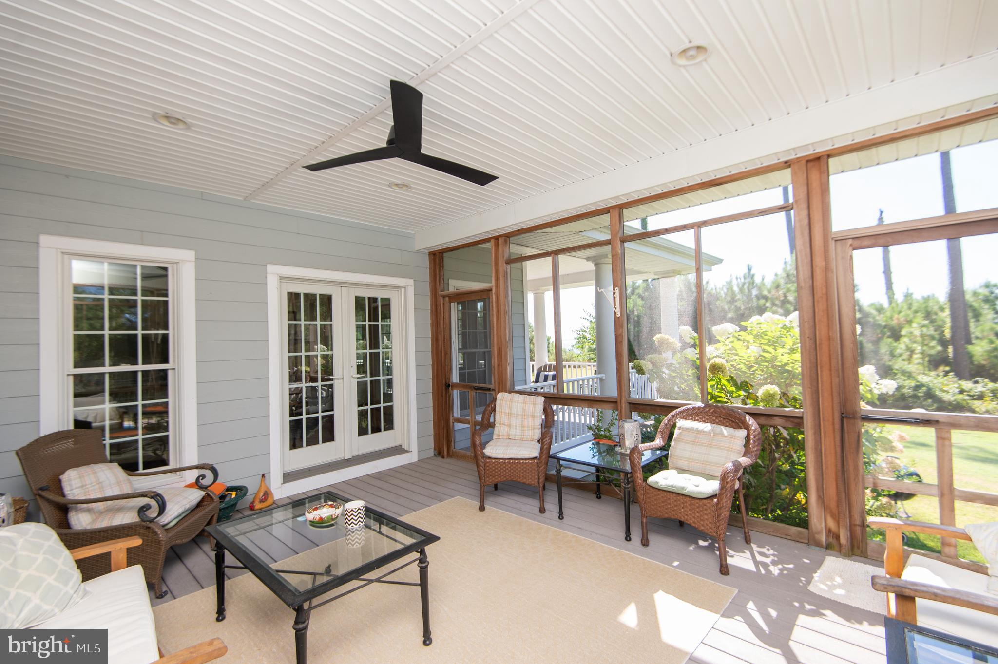 5332 Ragged Point Road Cambridge, MD 21613 - Photo 24 of 65 Screened porch opens to Great and Breakfast Rooms