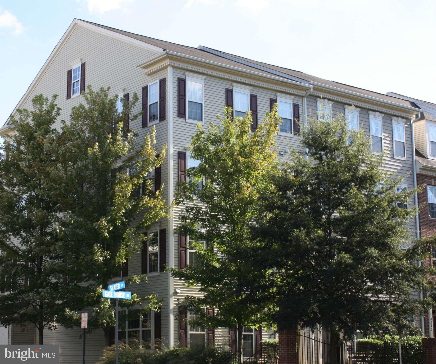 8075 Gatehouse Road, Unit 24 Falls Church, VA 22042 - Photo 2 of 24 a front view of a house with trees