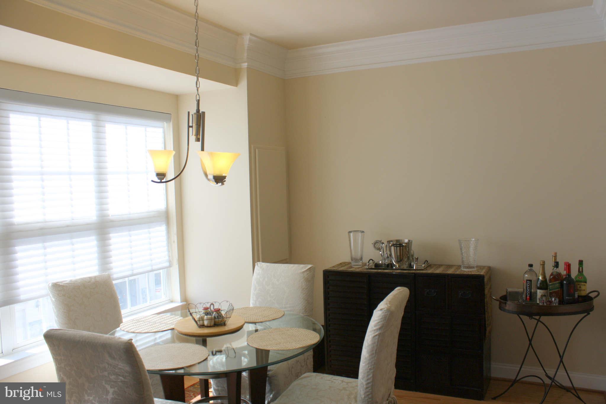 8075 Gatehouse Road, Unit 24 Falls Church, VA 22042 - Photo 13 of 24 a view of a dining room with furniture and window