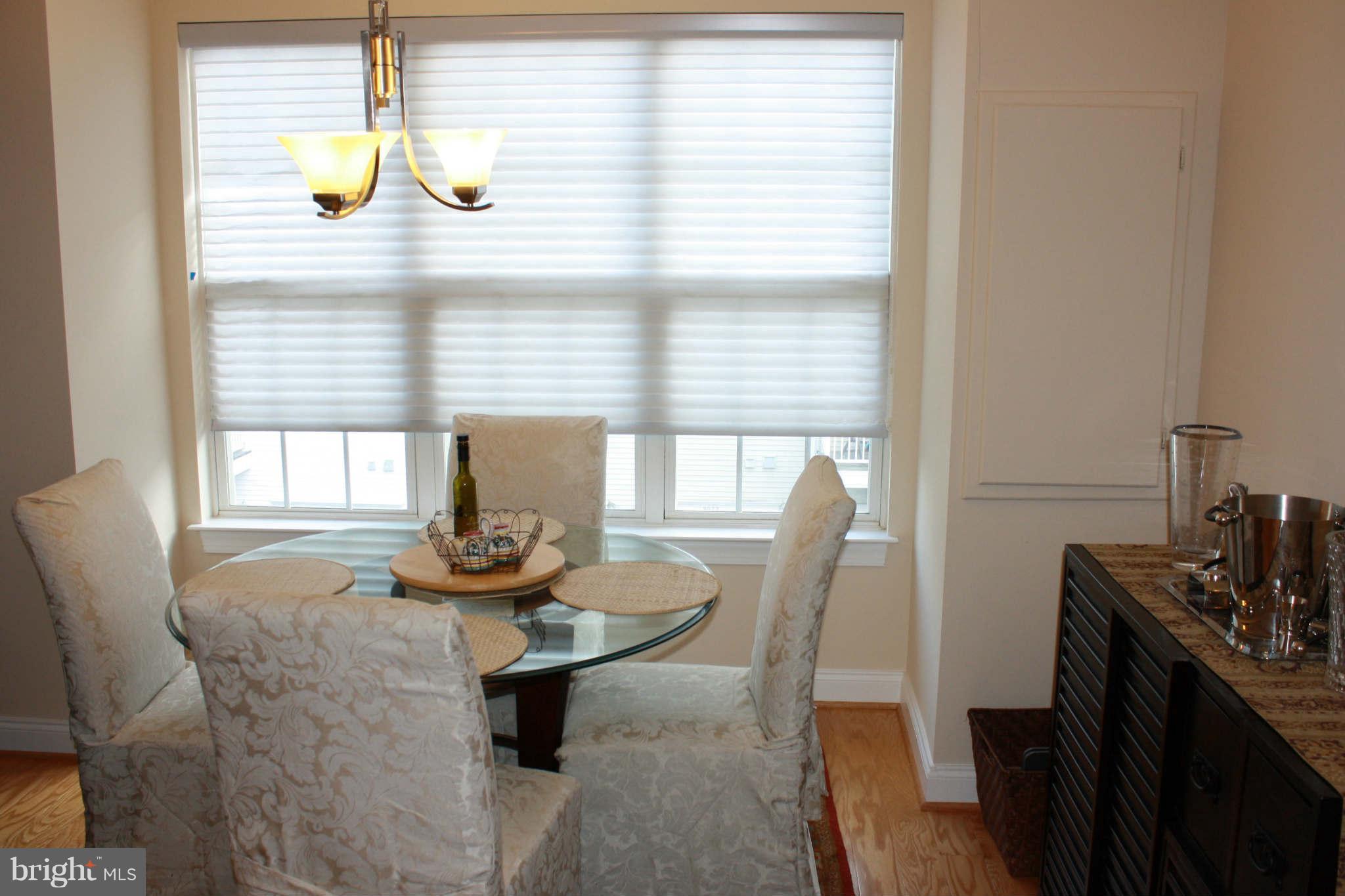 8075 Gatehouse Road, Unit 24 Falls Church, VA 22042 - Photo 14 of 24 a dining room with furniture and window