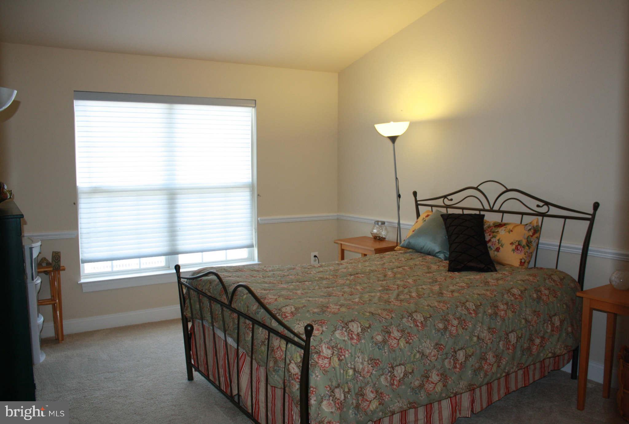 8075 Gatehouse Road, Unit 24 Falls Church, VA 22042 - Photo 20 of 24 a bedroom with a bed and a window