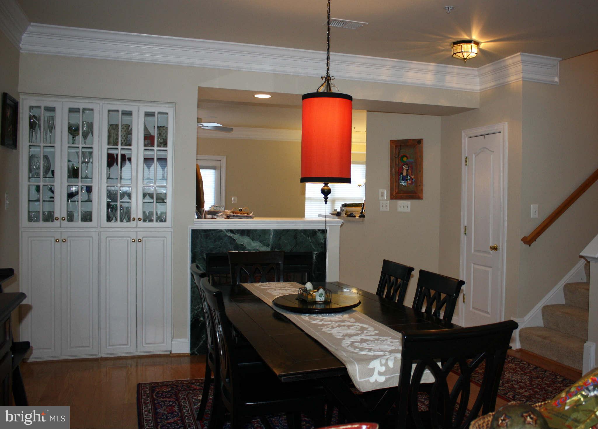 8075 Gatehouse Road, Unit 24 Falls Church, VA 22042 - Photo 6 of 24 a view of a dining room with furniture window and wooden floor