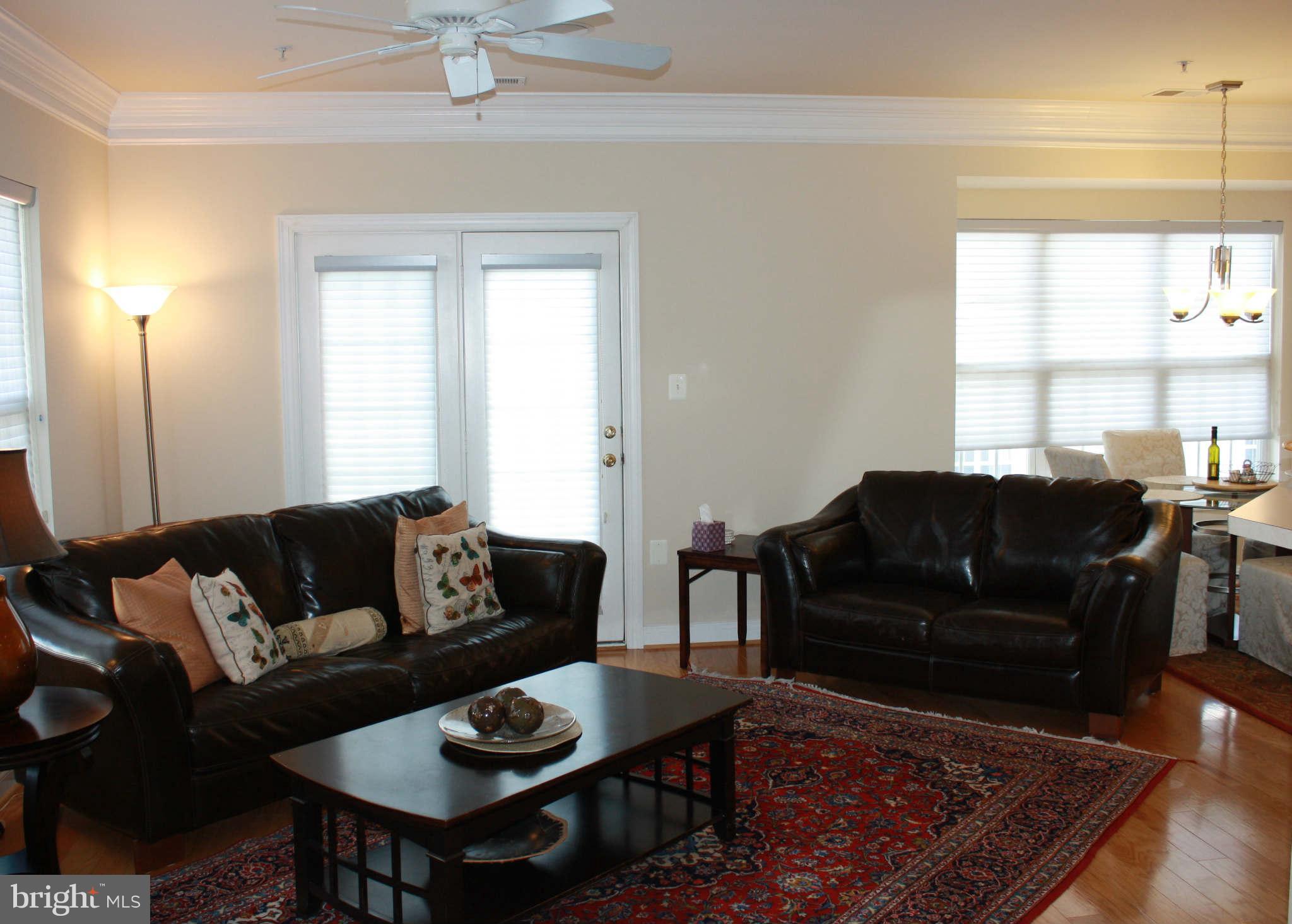 8075 Gatehouse Road, Unit 24 Falls Church, VA 22042 - Photo 9 of 24 a living room with furniture and a large window