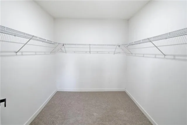 a bathroom with double vanity sink and two mirror