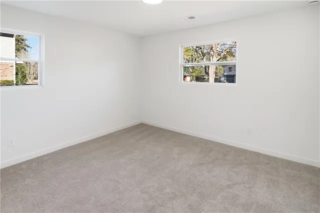 a view of a balcony with wooden floor