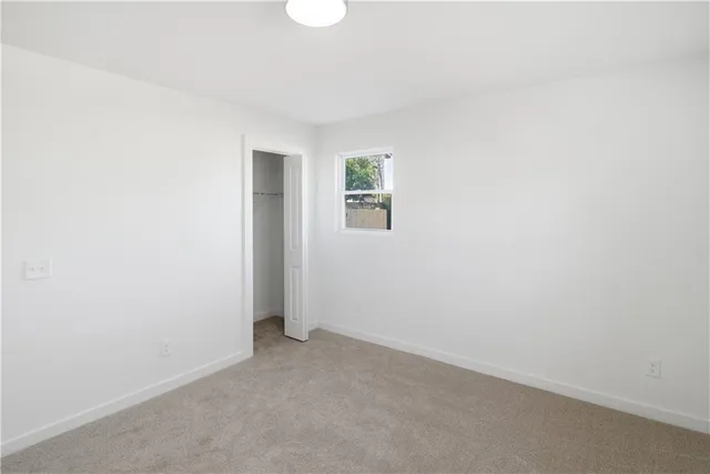a view of a house with a snow in the yard