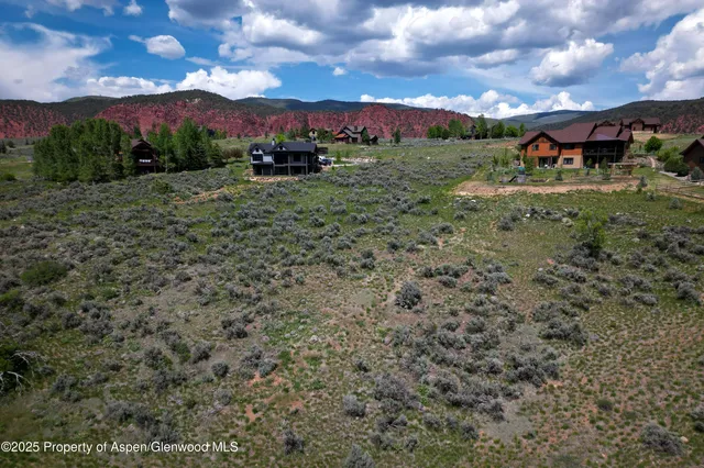 a view of a town with trees