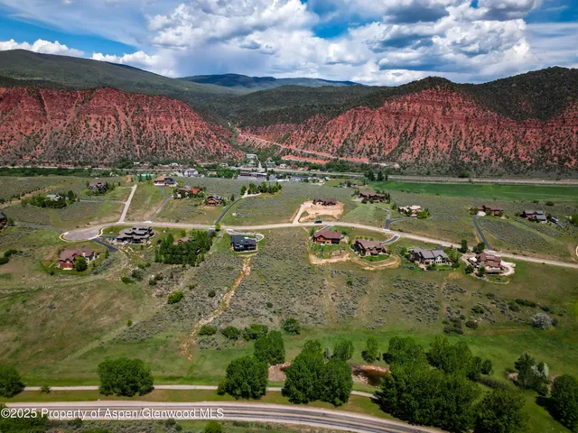 a view of a city with mountains in the background