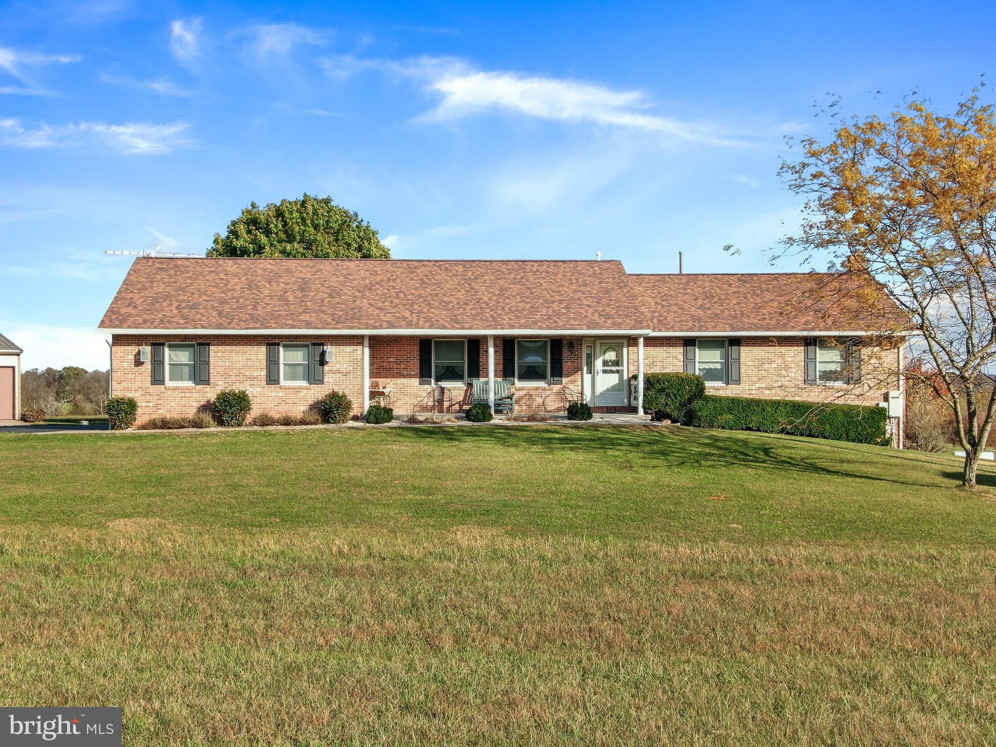 8920 Orndorff Road Emmitsburg, MD 21727 - Photo 17 of 91 a front view of a house with a yard table and chairs