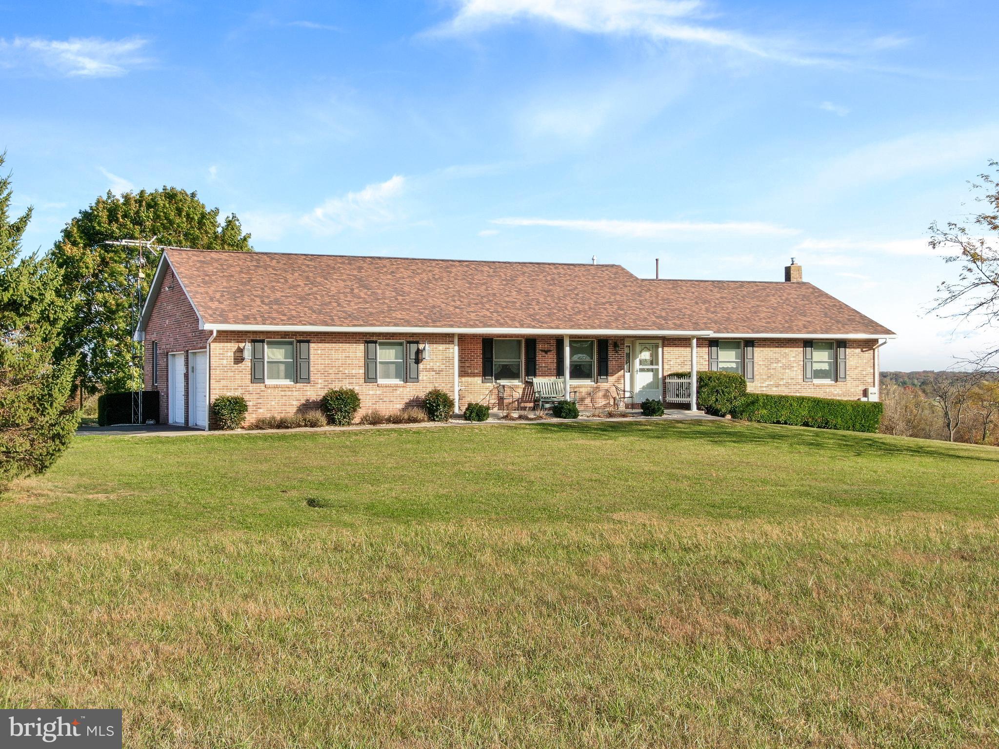 8920 Orndorff Road Emmitsburg, MD 21727 - Photo 18 of 91 a front view of a house with a yard table and chairs