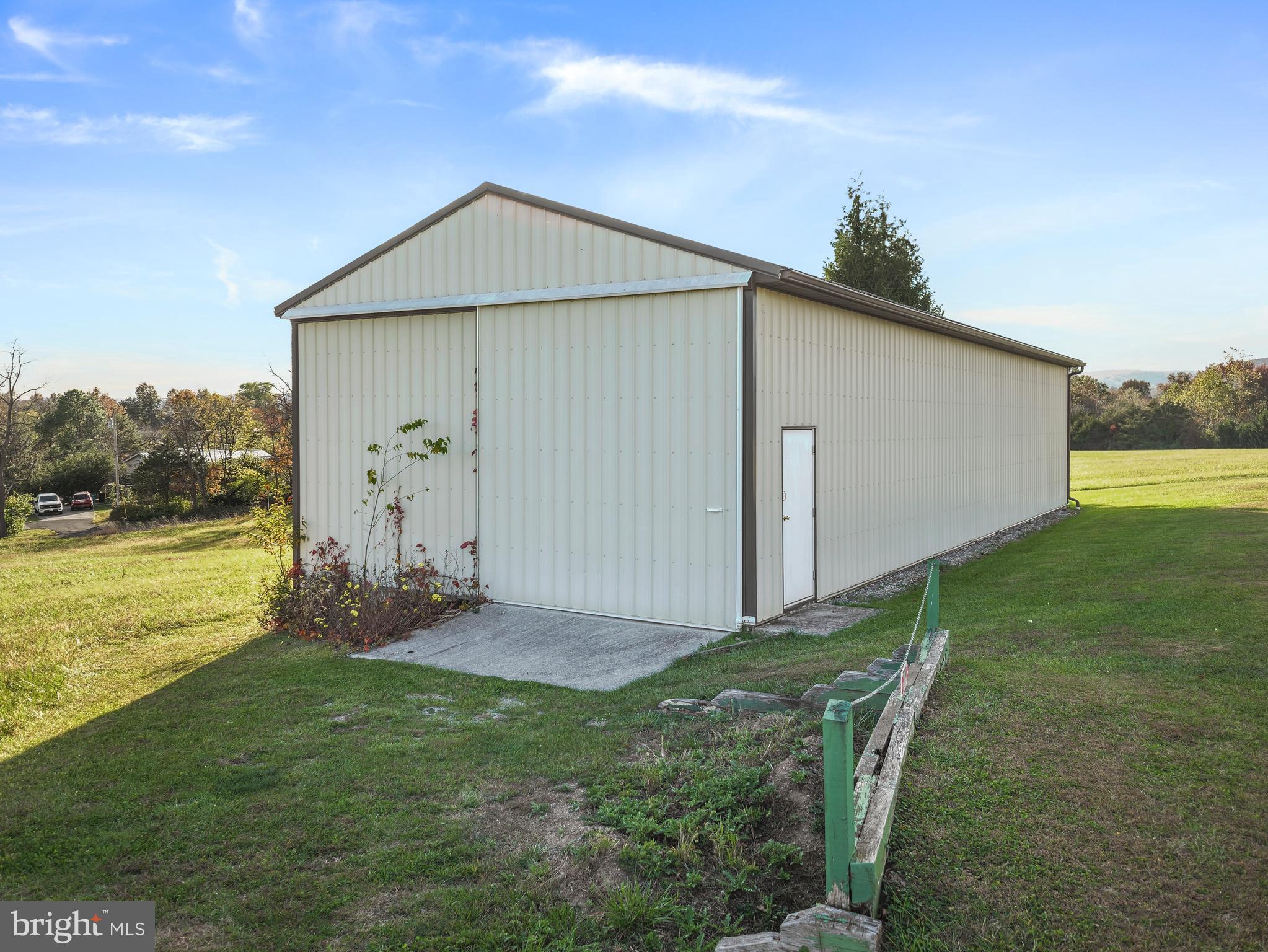 8920 Orndorff Road Emmitsburg, MD 21727 - Photo 31 of 91 a backyard of a house with plants and wooden fence