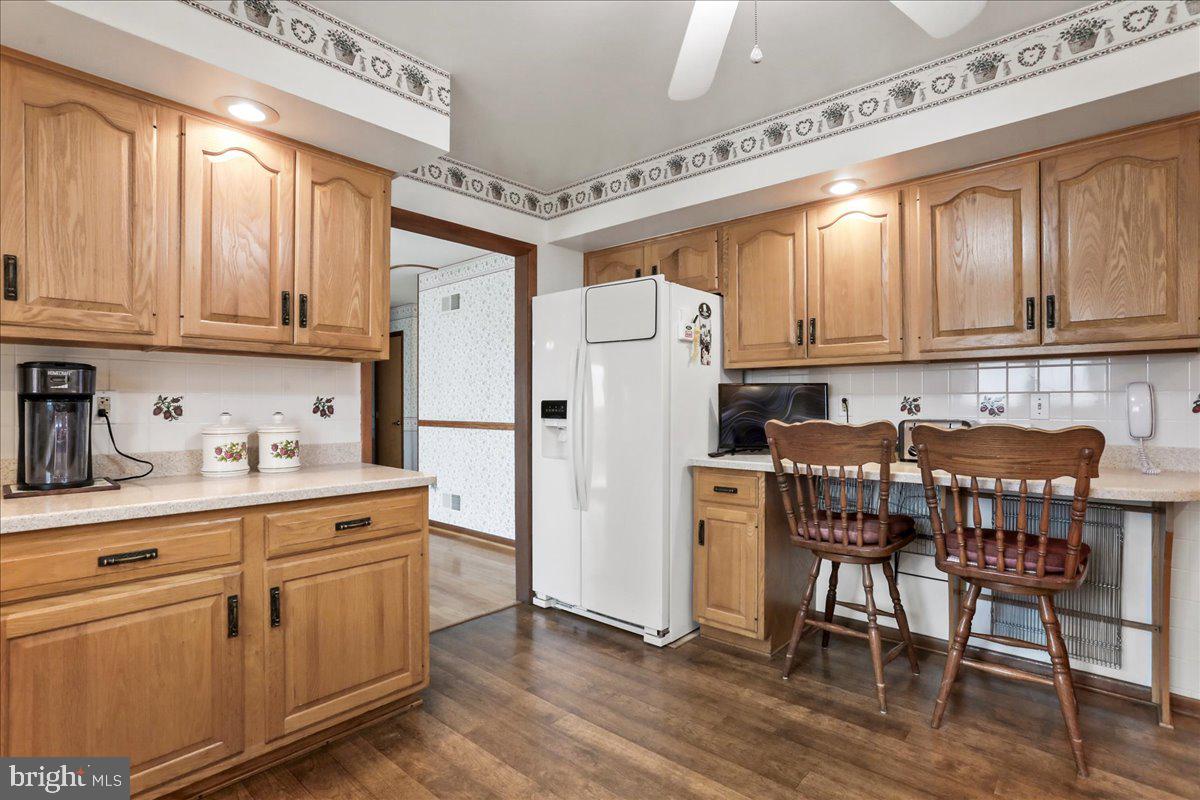8920 Orndorff Road Emmitsburg, MD 21727 - Photo 58 of 91 a kitchen with stainless steel appliances white cabinets and wooden floors