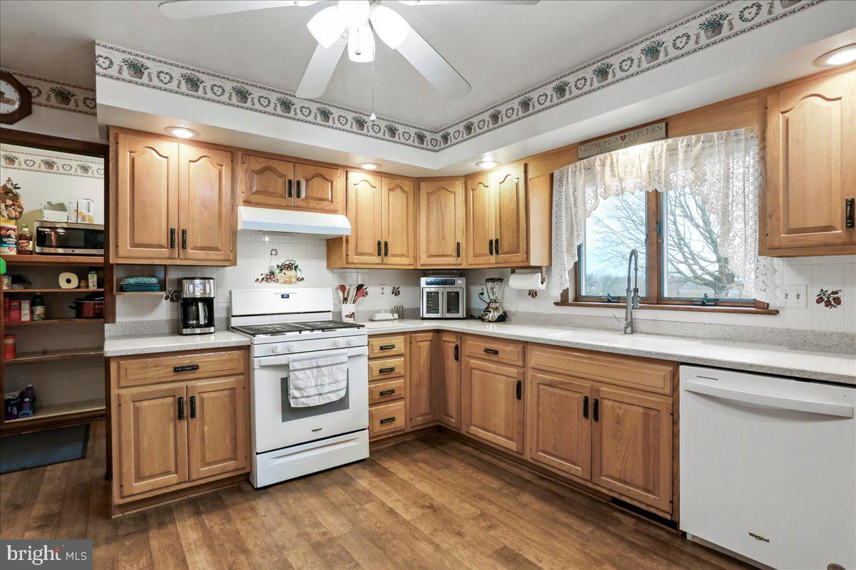 8920 Orndorff Road Emmitsburg, MD 21727 - Photo 60 of 91 a kitchen with a sink cabinets stainless steel appliances and a large window