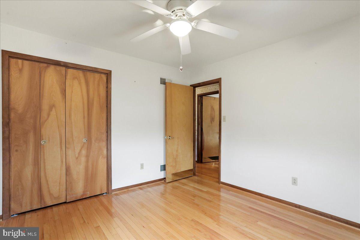 8920 Orndorff Road Emmitsburg, MD 21727 - Photo 74 of 91 an empty room with wooden floor closet and windows
