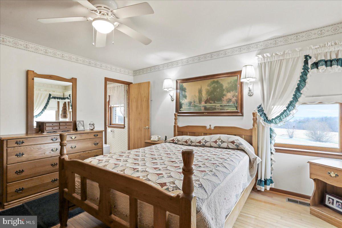 8920 Orndorff Road Emmitsburg, MD 21727 - Photo 76 of 91 a bedroom with a bed and a dresser