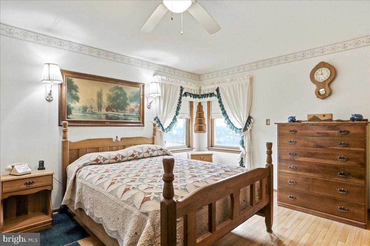 8920 Orndorff Road Emmitsburg, MD 21727 - Photo 78 of 91 a bedroom with a bed and a dresser