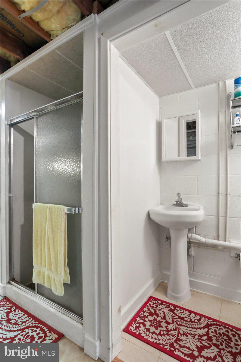 8920 Orndorff Road Emmitsburg, MD 21727 - Photo 86 of 91 a bathroom with a sink and a mirror