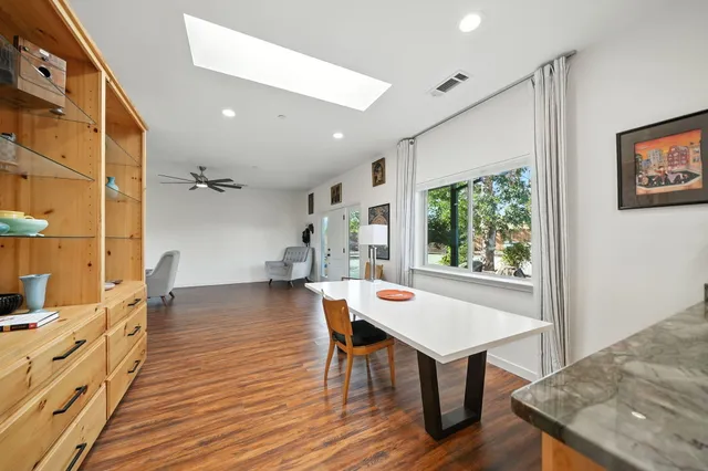 a view of a livingroom with furniture and wooden floor