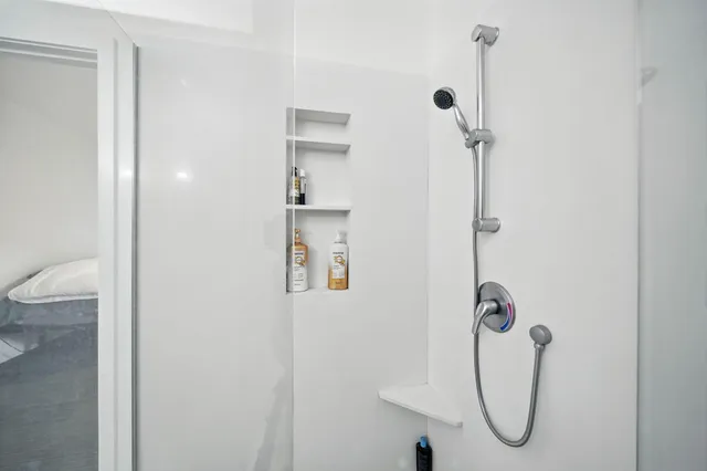 a room with a bed and a window