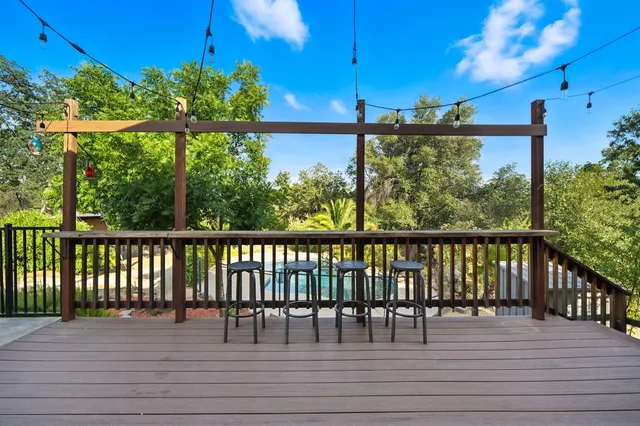 a view of a swimming pool with a patio