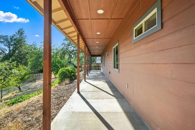 a view of a backyard of the house