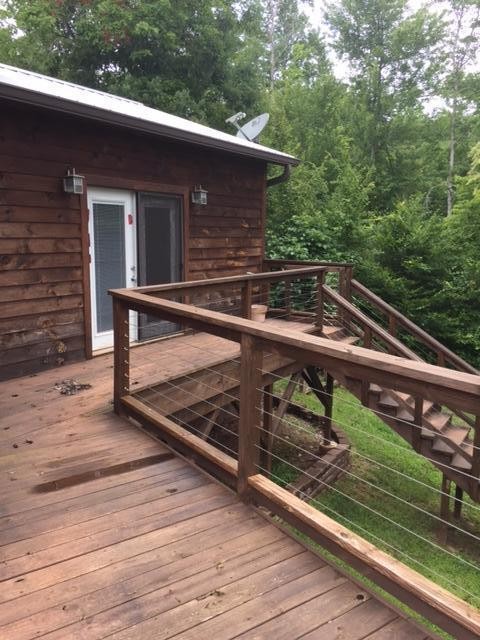 293 Harris Branch Road Madisonville, TN 37354 - Photo 16 of 31 a view of a roof deck with wooden floor and fence