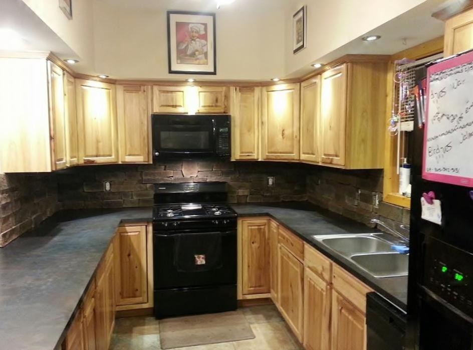 293 Harris Branch Road Madisonville, TN 37354 - Photo 26 of 31 a kitchen with stainless steel appliances granite countertop a stove a sink and a microwave