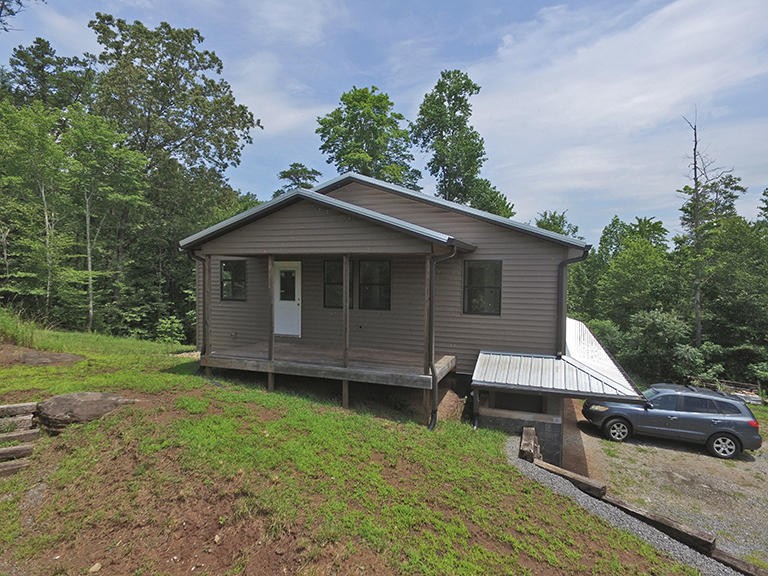 293 Harris Branch Road Madisonville, TN 37354 - Photo 29 of 31 a view of a house with a yard