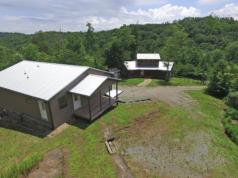293 Harris Branch Road Madisonville, TN 37354 - Photo 30 of 31 a backyard of a house with lots of green space