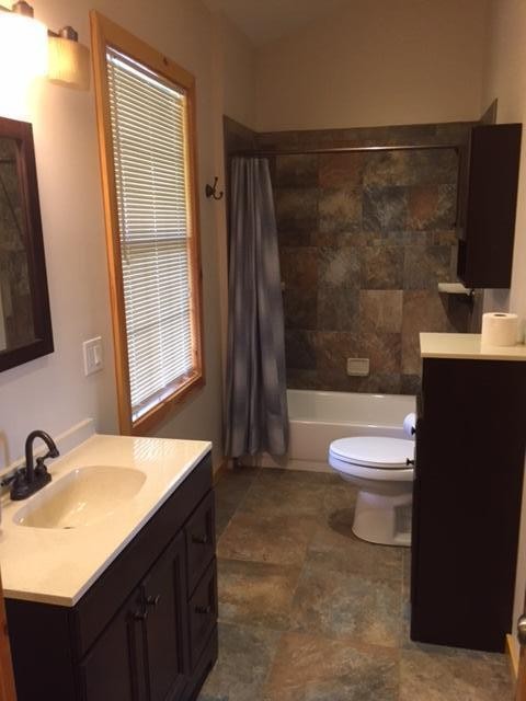 293 Harris Branch Road Madisonville, TN 37354 - Photo 10 of 31 a bathroom with a sink a toilet and shower