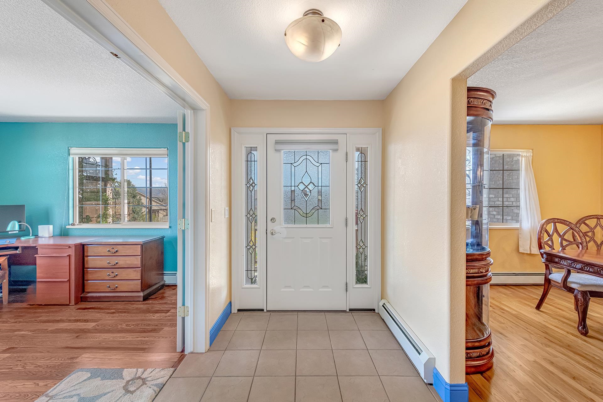 927 Crown Court Fruita, CO 81521 - Photo 5 of 42 a view of a livingroom with workspace and a window