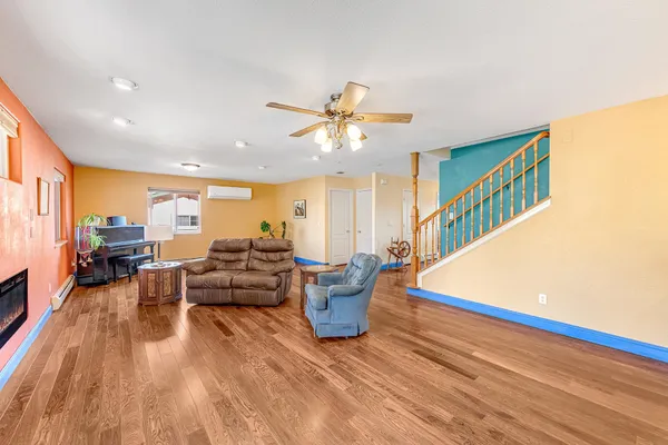 a living room with furniture and a chandelier