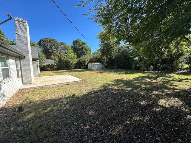 a view of a yard with an outdoor space