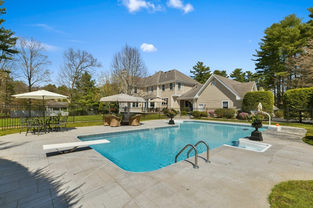 59 Anderson Farm Road Hanover, MA 02339 - Photo 34 of 38 a view of a house with swimming pool and sitting area