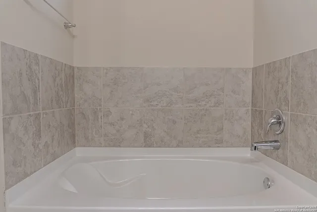 a bathroom with a bathtub