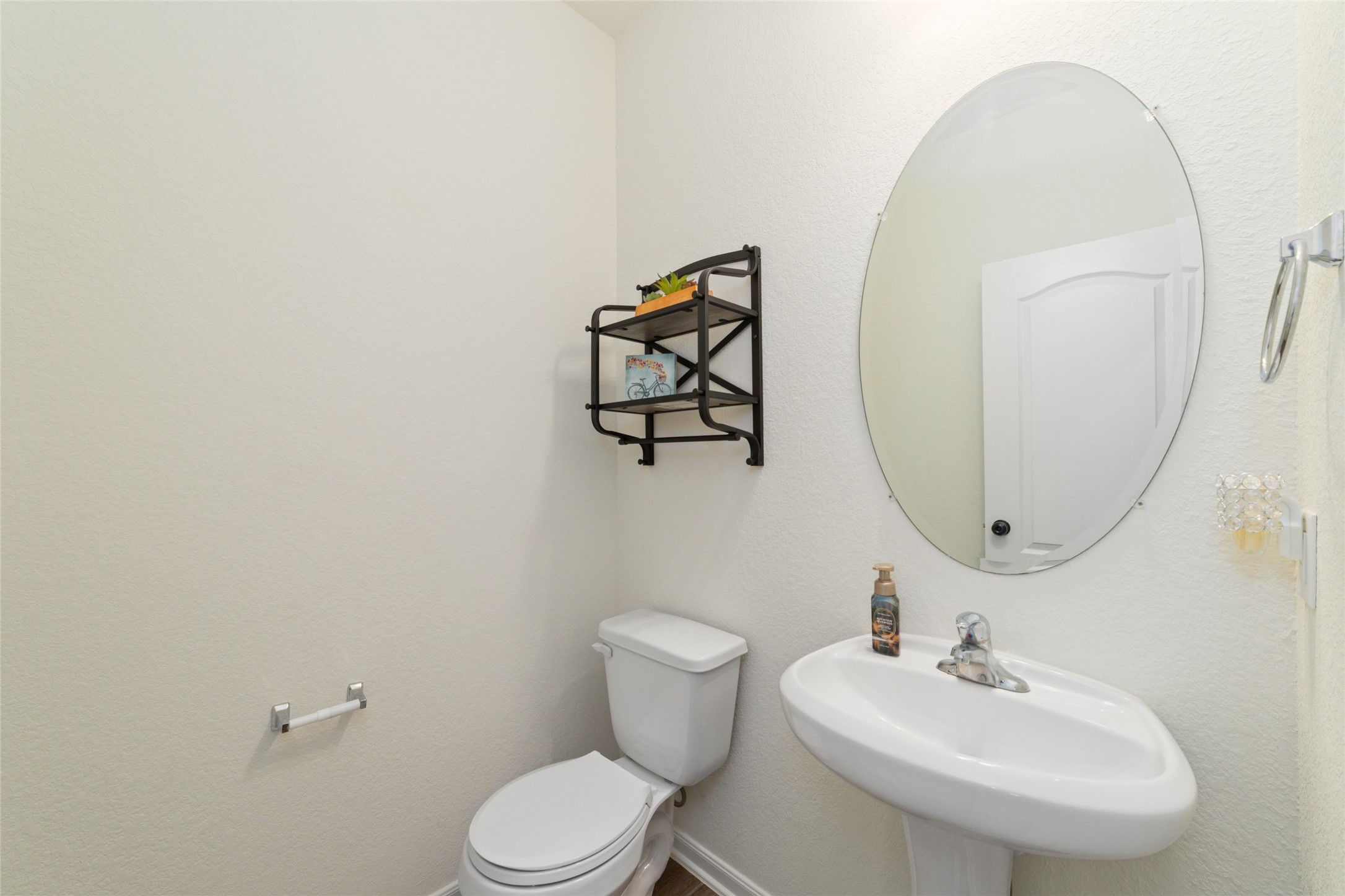 25414 Whitehaven Gate Street Katy, TX 77493 - Photo 16 of 32 a bathroom with a toilet sink and mirror