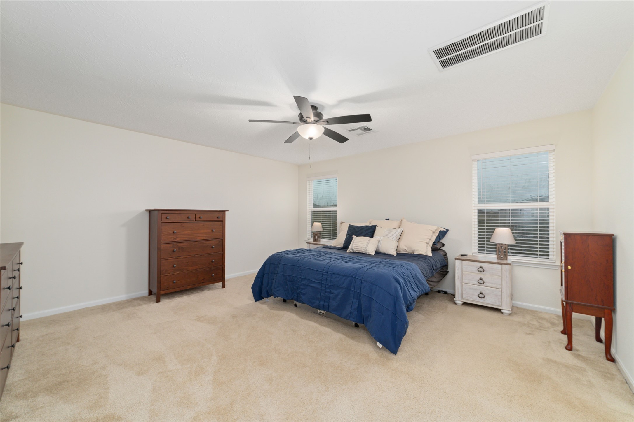 25414 Whitehaven Gate Street Katy, TX 77493 - Photo 21 of 32 a bedroom with furniture and a ceiling fan