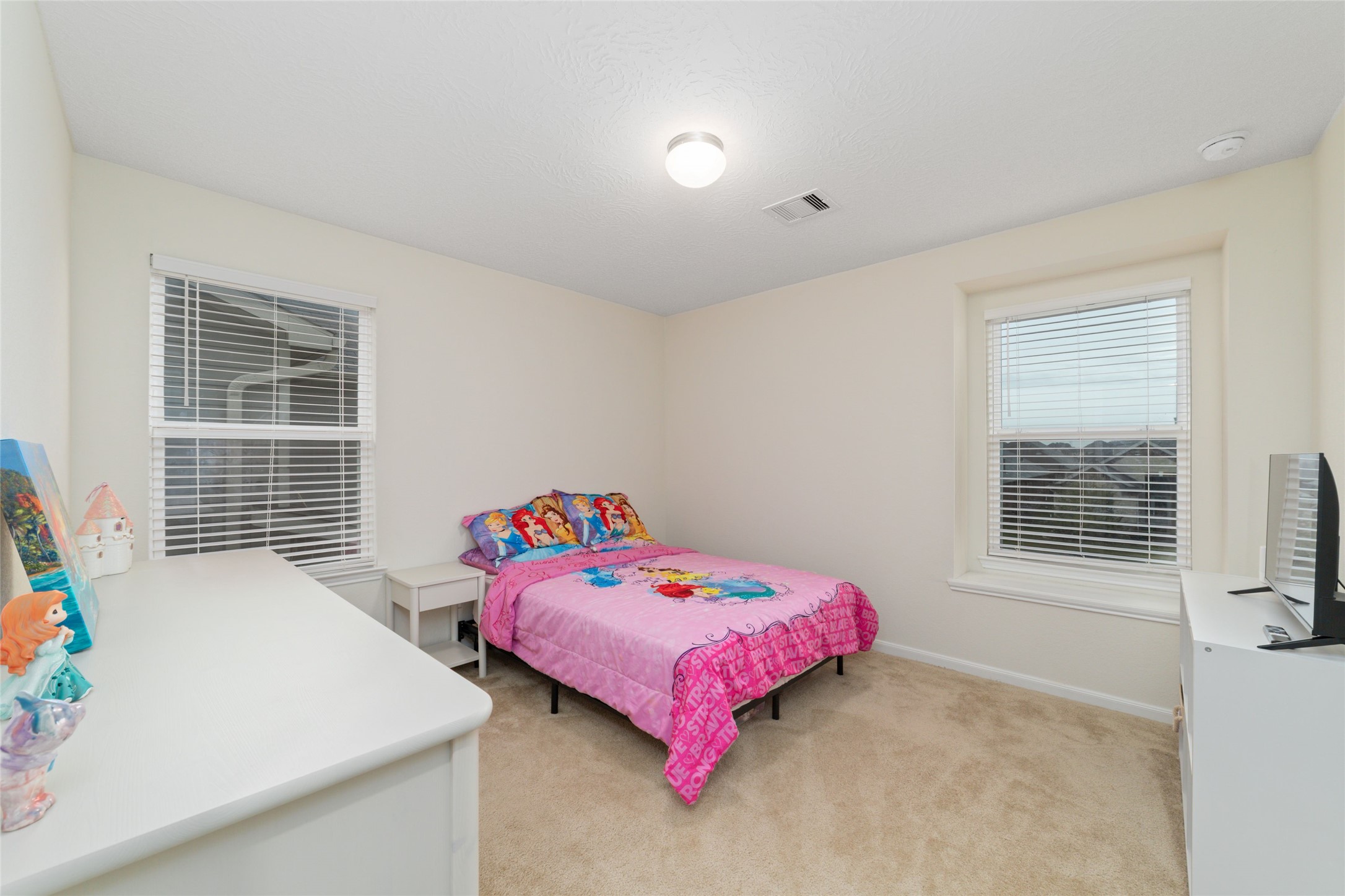 25414 Whitehaven Gate Street Katy, TX 77493 - Photo 26 of 32 a bedroom with a bed and a window