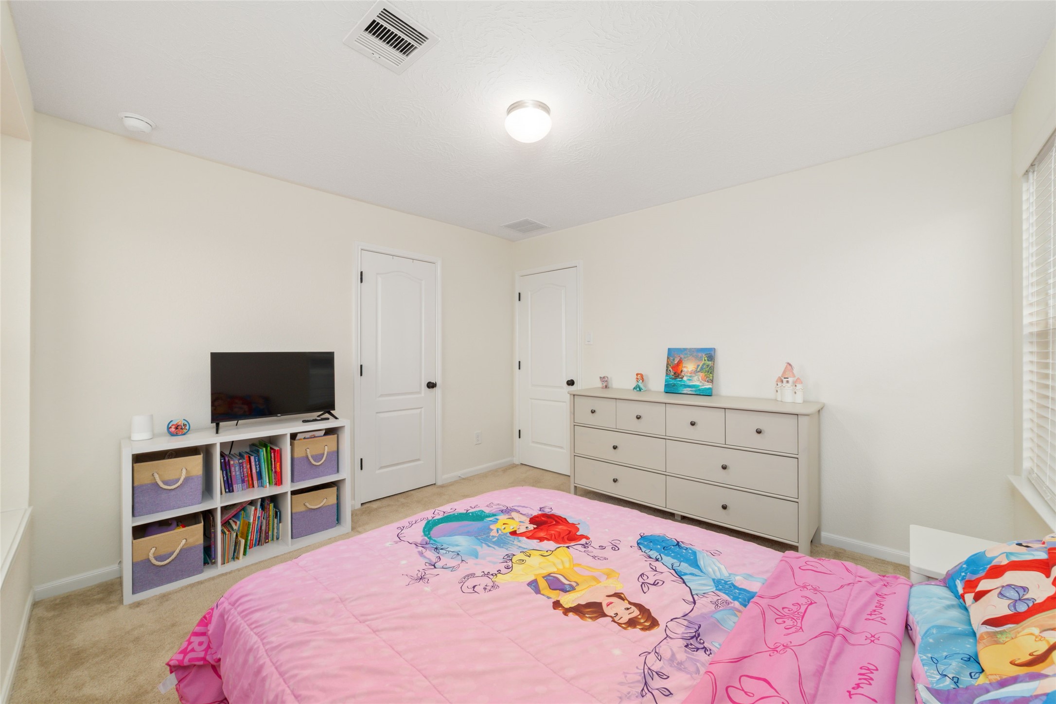 25414 Whitehaven Gate Street Katy, TX 77493 - Photo 27 of 32 a bedroom with a bed and a flat screen tv