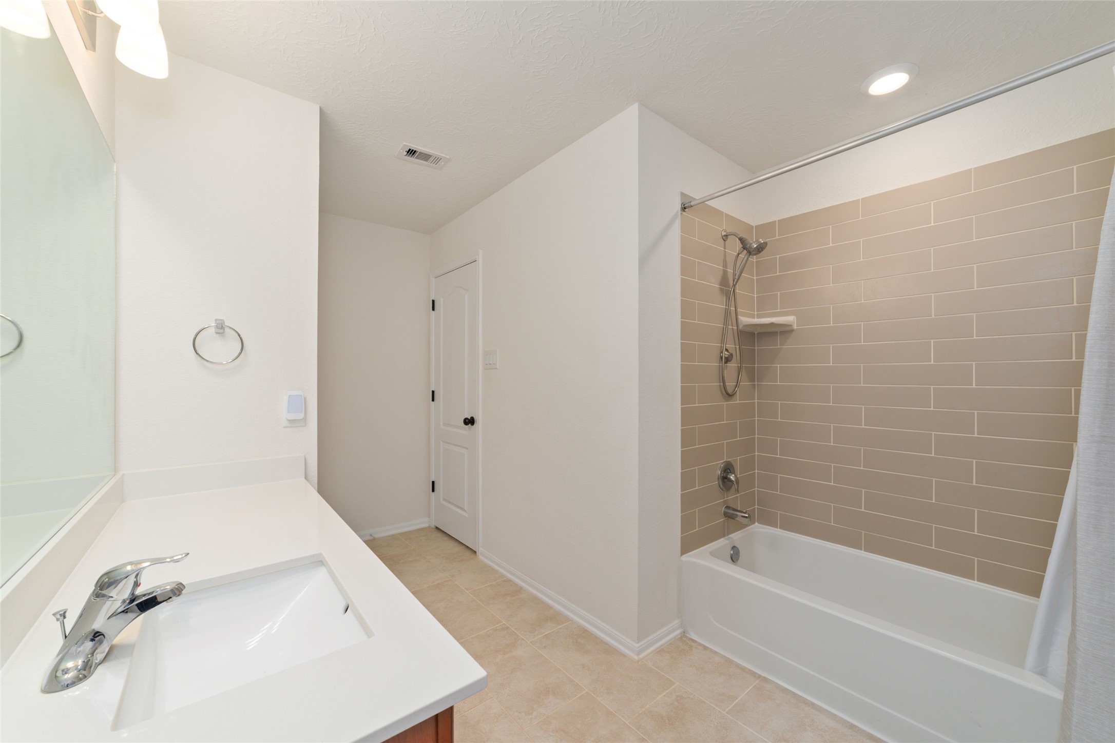 25414 Whitehaven Gate Street Katy, TX 77493 - Photo 29 of 32 a bathroom with a tub a sink and a shower