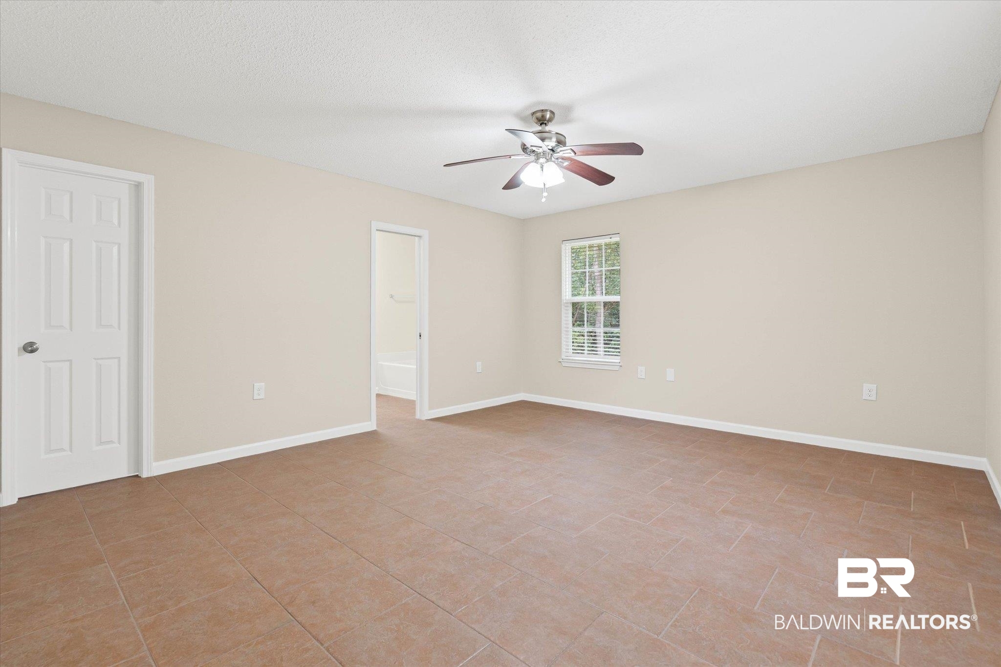 157 Bay View Drive Daphne, AL 36526 - Photo 7 of 22 Unfurnished room with baseboards and ceiling fan