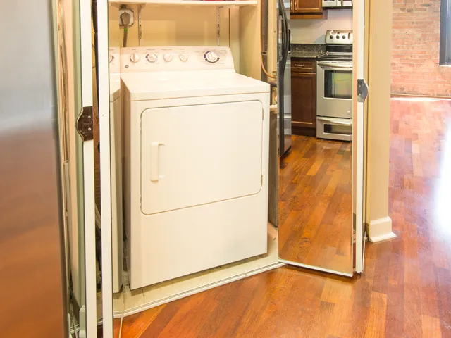 a view of a patio with couches table and chairs and potted plants
